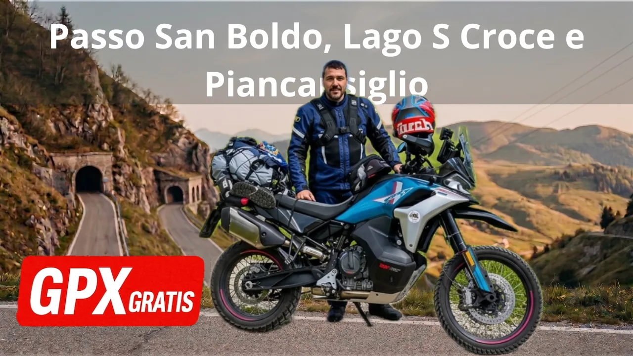 Motociclista con moto da enduro davanti a strada di montagna e tunnel. Testo: Passo San Boldo e GPX Gratis.